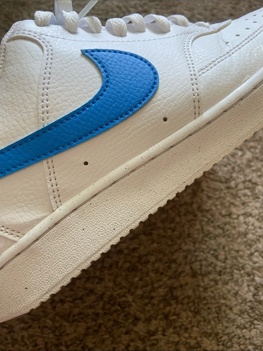 Nike White Low-Top Sneakers with Blue Swoosh